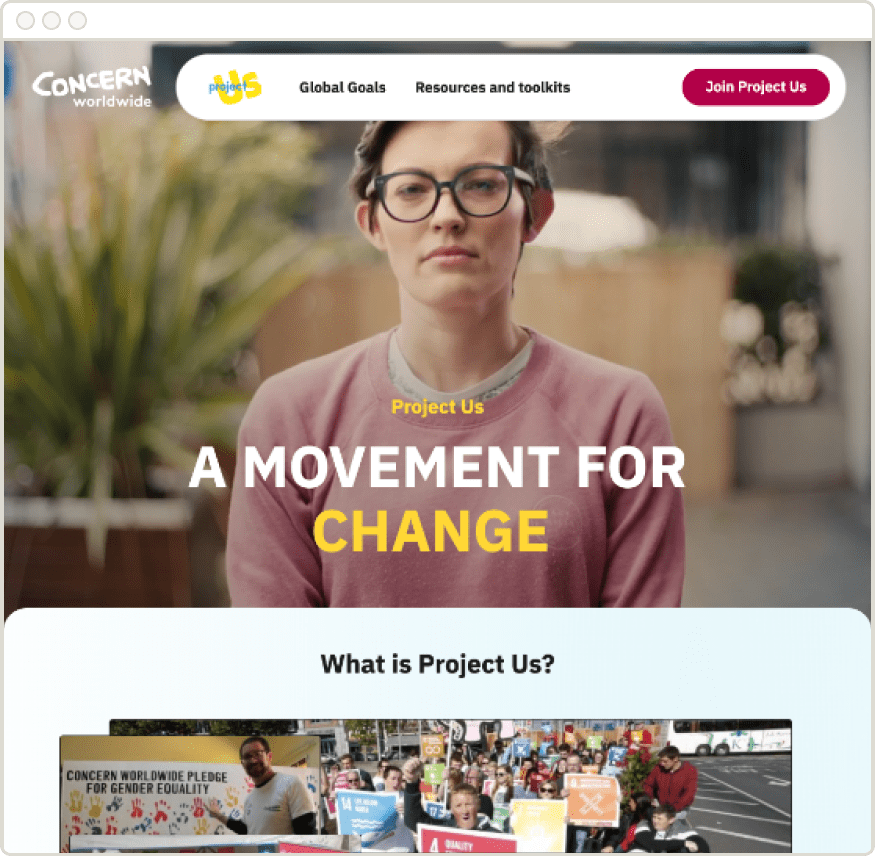 A screenshot of the "Project Us" webpage by Concern Worldwide. The top of the page features the Concern Worldwide and Project Us logos, navigation links for "Global Goals" and "Resources and toolkits", and a "Join Project Us" button. The main image shows a person with short dark hair and glasses, wearing a pink sweatshirt, looking directly at the camera. Overlaid on the image is the text "Project Us" and "A MOVEMENT FOR CHANGE," with the word "CHANGE" highlighted in yellow. Below this, a section with a white background is titled, "What is Project Us?", followed by a collage of photos showing people participating in activities, including one in front of a banner for gender equality.