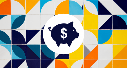 Piggy bank on a coloured tile background
