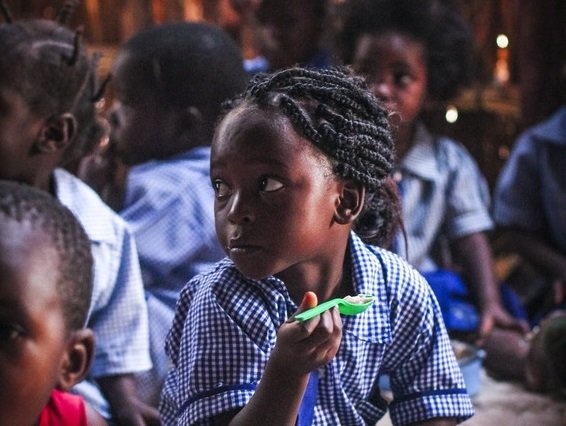 Child eating lunch at a Concern-supported school